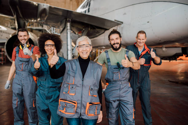istock Group of happy aircraft mechanics 1059982146