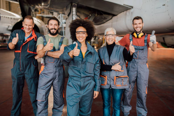 istock Mechanic team pointing thumbs up 1059982172