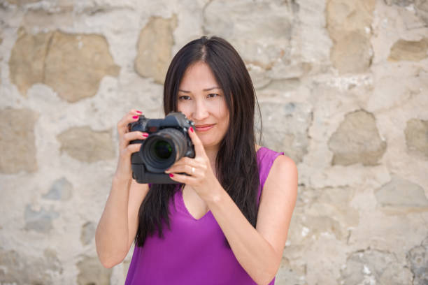 istock Asian Female Traveler Taking Photos 1059984796