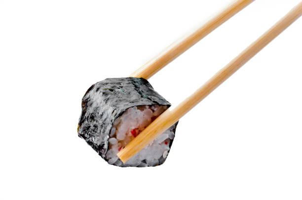 istock Sushi hold on a white background isolated with chopsticks 1059984876