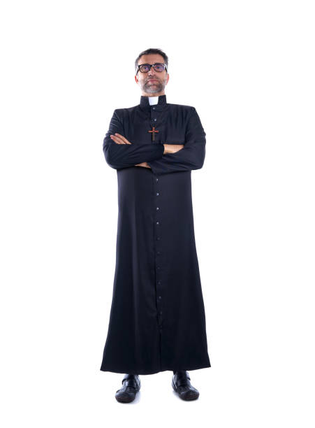 istock Full length priest crossed arms with soutane 1059987616