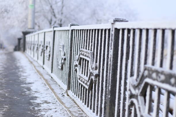 istock snow-covered bridge fence 1059996490