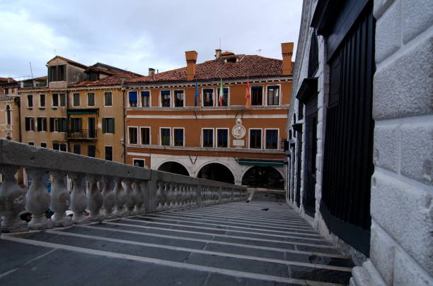 istock Early morning walk  across Rialto Bridge, Venice 1059997220