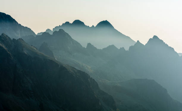 istock Morning fog between mountain ranges. 1059999062