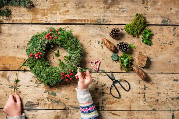 istock Overhead view of Christmas wreaths being made. 1060000340
