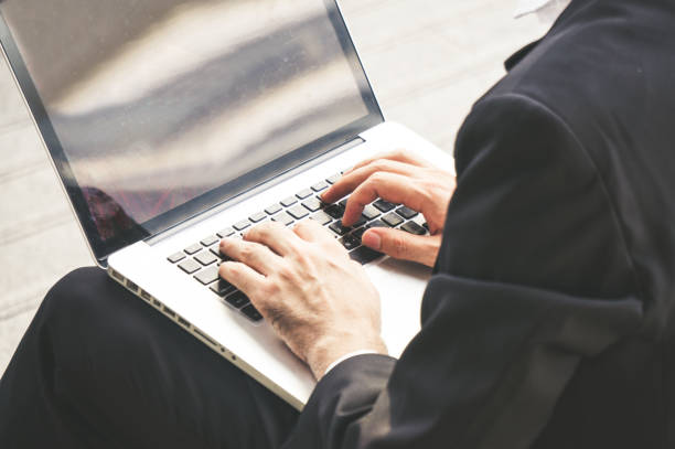 istock Businessman working and typing on labtop 1060001272