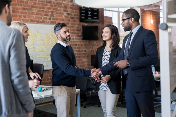 istock Businessman greeting colleague during meeting 1060001280