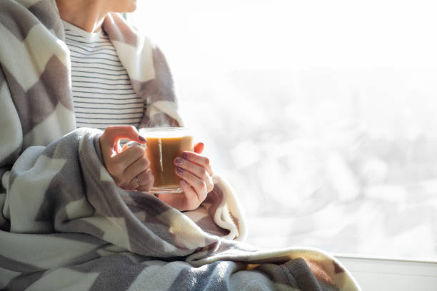 istock Hot steaming drink in woman's hands 1060001306