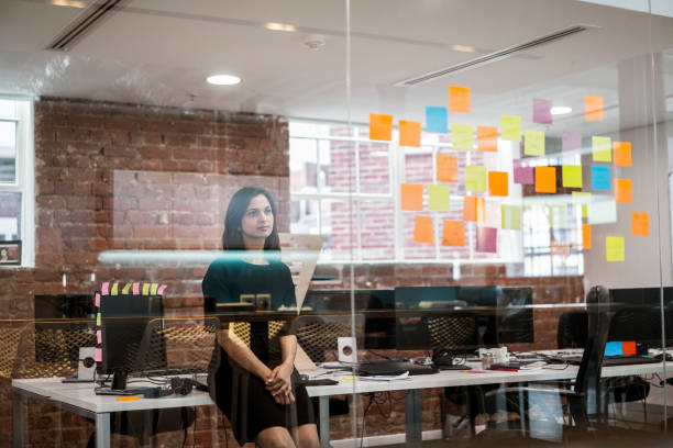 istock Businesswoman reading notes seen through glass 1060002764