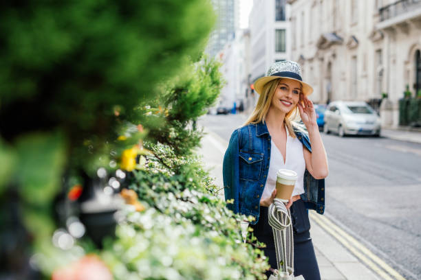 istock Cheerful British woman drinking coffee and going to work 1060003286