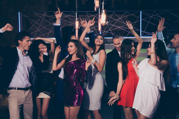 istock Beautiful nice adorable attractive cool bright elegant cheerful glad classy stylish trendy ladies and gentlemen at cocktail party, chill out at fashionable night club 1060015554