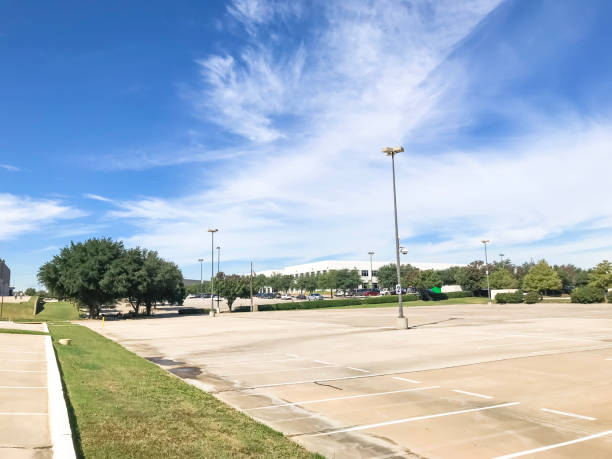istock Huge empty urban parking lot on cloud blue sky in Texas, USA 1060023326