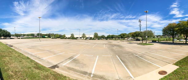 istock Panoramic huge empty urban parking lot on cloud blue sky in Texas, USA 1060023562