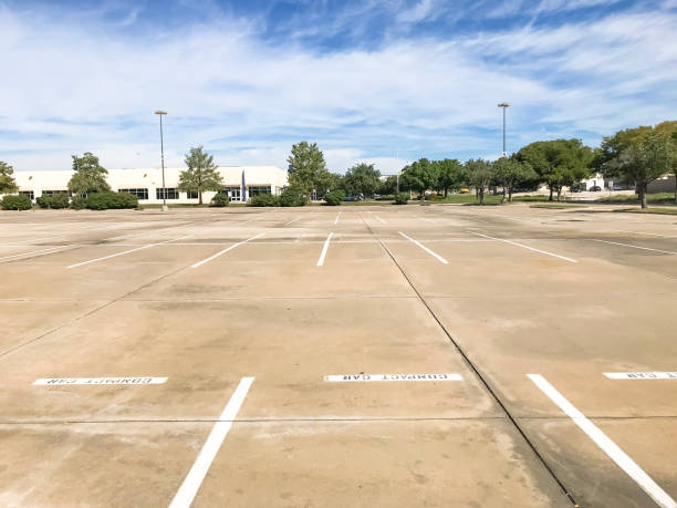 istock Huge empty urban parking lot on cloud blue sky in Texas, USA 1060024698