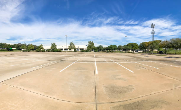 istock Huge empty urban parking lot on cloud blue sky in Texas, USA 1060024954
