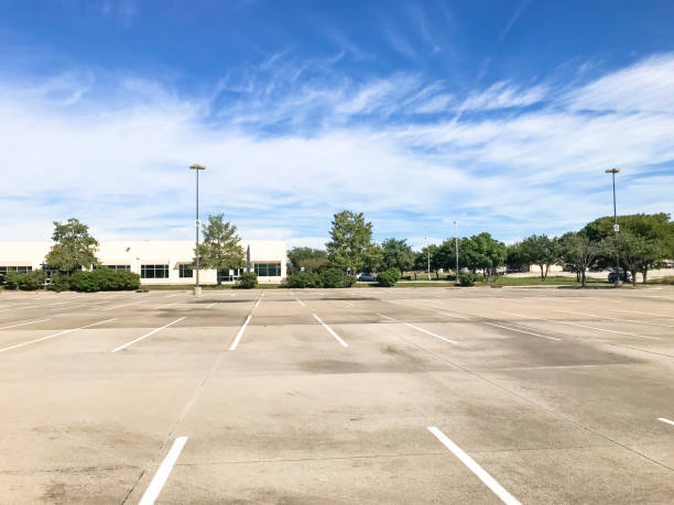 istock Huge empty urban parking lot on cloud blue sky in Texas, USA 1060025134