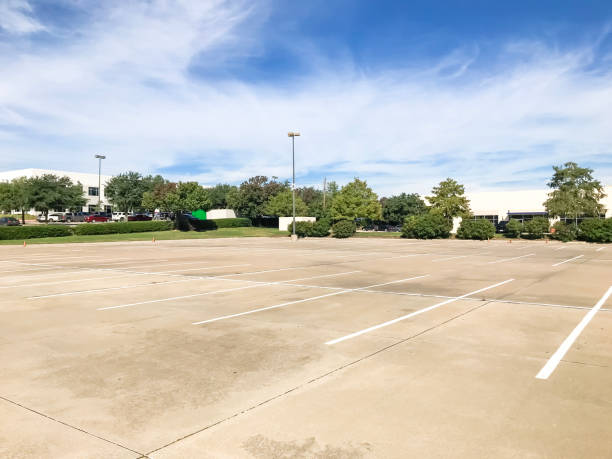 istock Huge empty urban parking lot on cloud blue sky in Texas, USA 1060025424