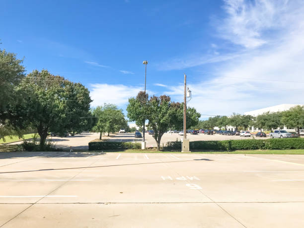 istock Huge empty urban parking lot on cloud blue sky in Texas, USA 1060025672