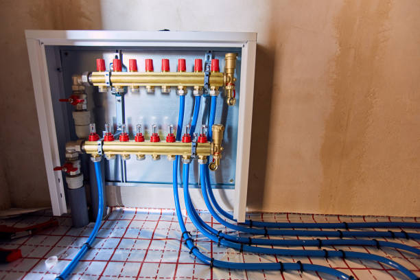 istock Laying blue pipes for floor heating at the construction site. 1060025978