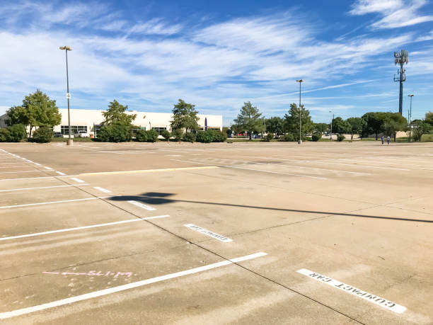 istock Huge empty urban parking lot on cloud blue sky in Texas, USA 1060028566