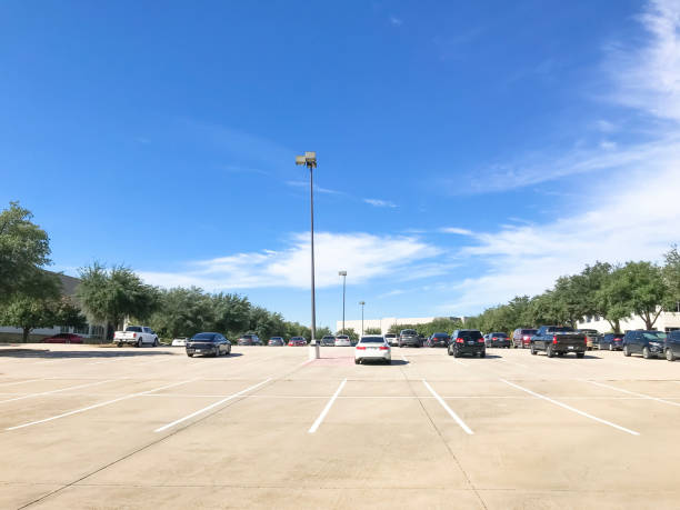 istock Huge empty urban parking lot on cloud blue sky in Texas, USA 1060033134