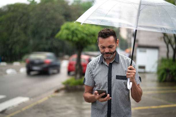 istock Mature man using mobile outdoors 1060042824