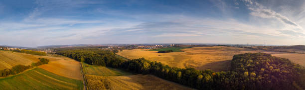 istock Autumnal fields and forests in the setting sun. 1060045900
