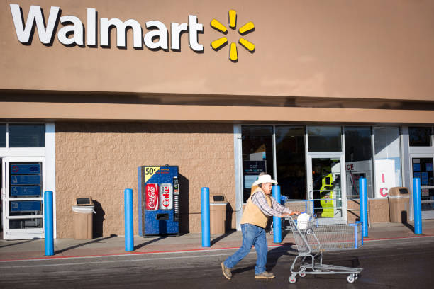 Santa Fe, NM: Senior Cowboy Pushes Cart Outside Walmart stock photo