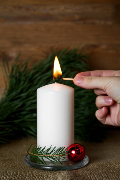 istock Lighted candle on wooden background, christmas 1060060232