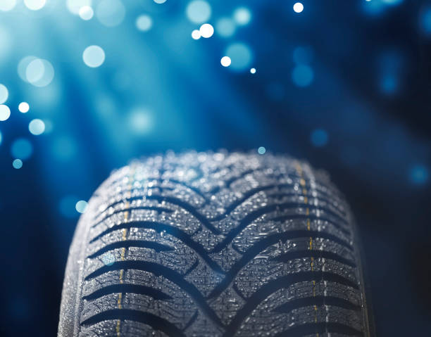istock New wet tire while raining with blue light and sparkles 1060060816
