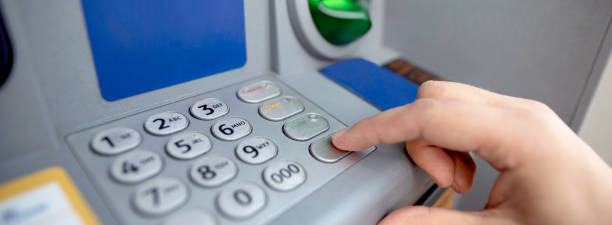 istock Man entering code on ATM. Close up of keypad. 1060064620