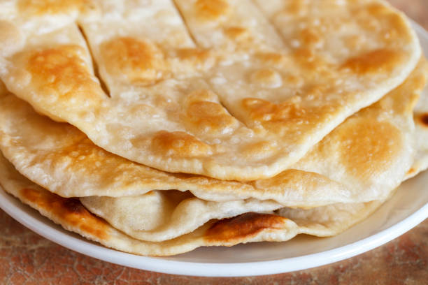 istock Russian fried home water-bisquits on white plate. Selective focus 1060064636