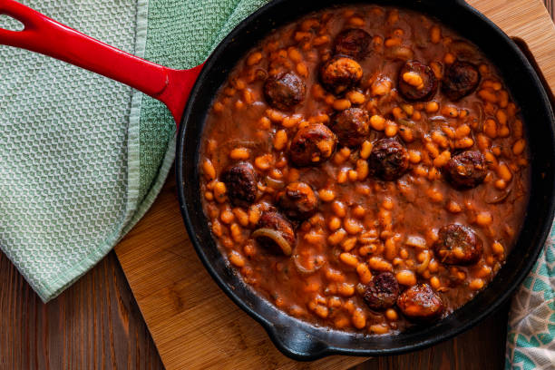 istock beans with sausage on a cast iron skillet 1060068616
