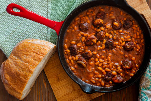 istock beans with sausage on a cast iron skillet 1060068762
