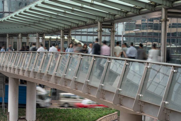 Kuala Lumpur, Malaysia - 26 March, 2024: Awesome inside view of Saloma Link Bridge. The pedestrian bridge is a popular tourist attraction of Asia. Amazing play of light and shadow.