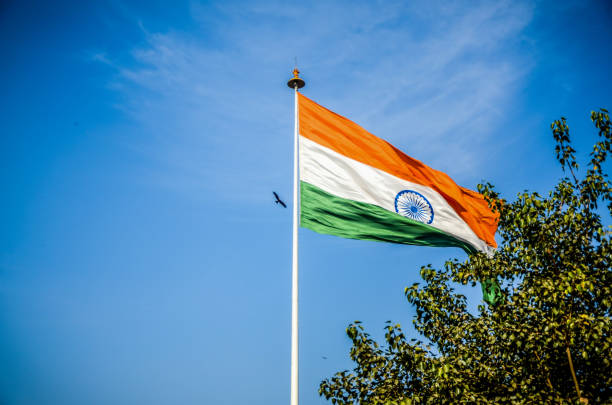 istock Indian flag hoisting high in the blue sky 1060071822