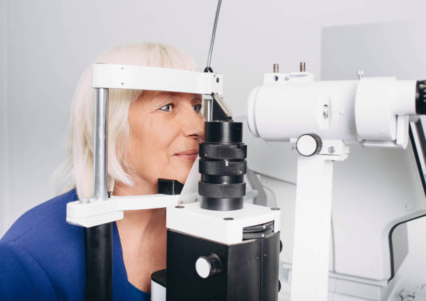 istock Senior woman doing eye test with eye equipment 1060077150