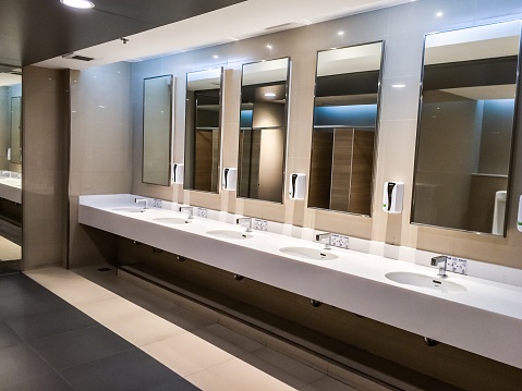 Men’s bathroom interior in the airport backgrounds