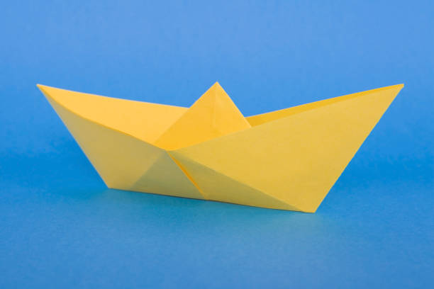 istock Small toy colored paper ship. 1060094274