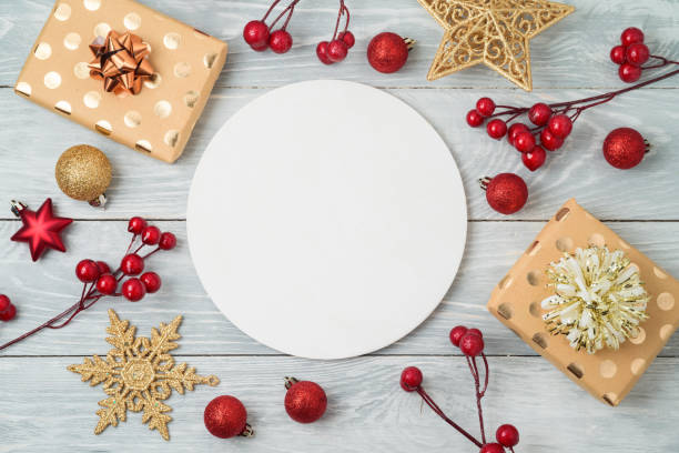 istock Christmas holiday background with gift boxes and decorations on wooden table 1060094670