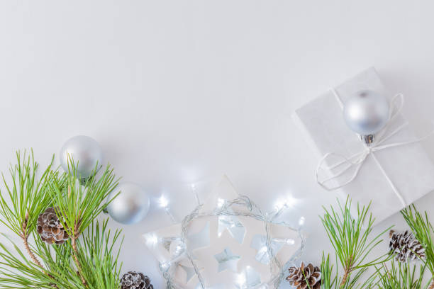 istock Holiday composition with pine branches and a garland 1060114018