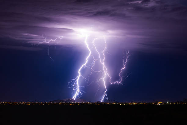 Lightning bolt storm Lightning bolt storm with thunderstorm clouds at night. thunderstorm stock pictures, royalty-free photos & images