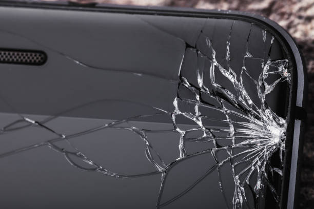 istock Broken glass on the phone screen with copy space 1060120996