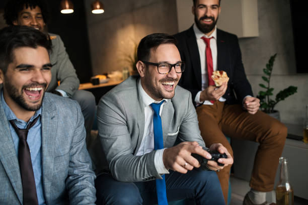 istock A group of young business man playing video games after work 1060129110