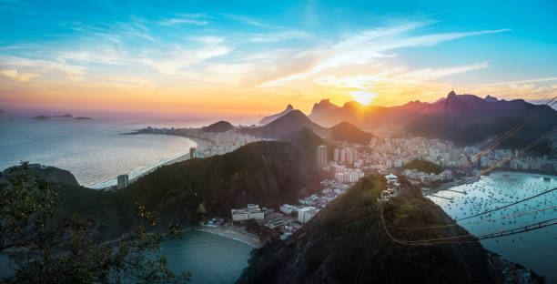 aerial view of rio de janeiro coast with copacabana, praia vermelha beach, urca and corcovado mountain at sunset - rio de janeiro, brazil - rio de janeiro guanabara bay sugarloaf mountain beach imagens e fotografias de stock