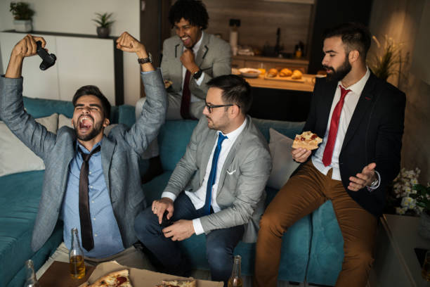 istock A group of young business man playing video games after work 1060129600