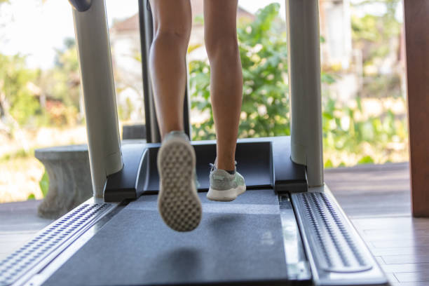 istock Low section of woman running on treadmill 1060135806