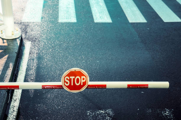 toll bar, stop sign, road, zebra crossing - boundary imagens e fotografias de stock