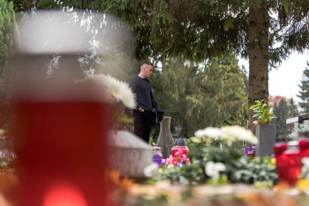 istock grieving soldier man in the cemetery 1060136218