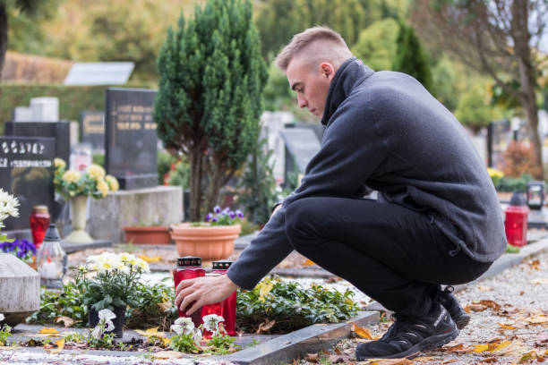 istock grieving soldier man in the cemetery 1060141214